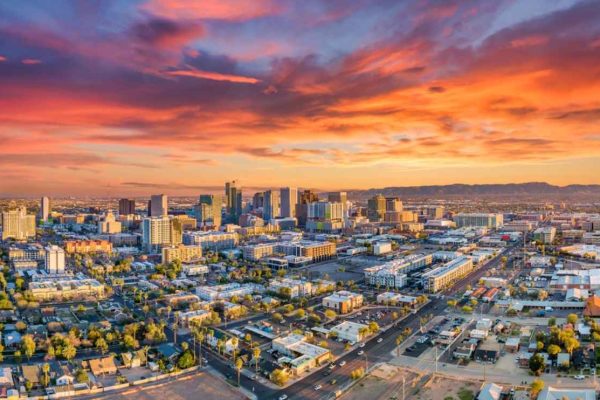 An aerial drone view of the tall buildings in downtown Phoenix, Arizona.