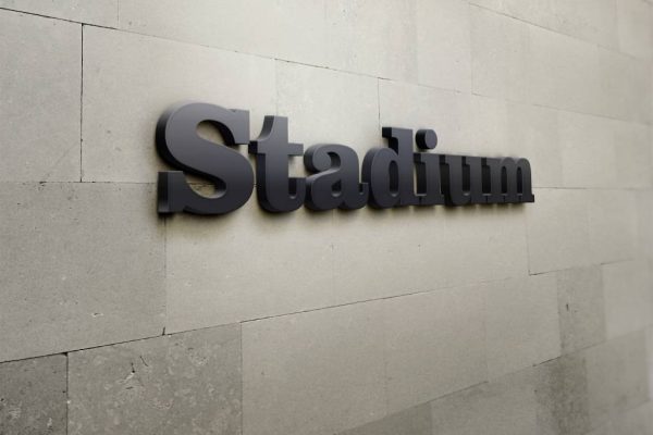 Building signage that reads 'Stadium'.